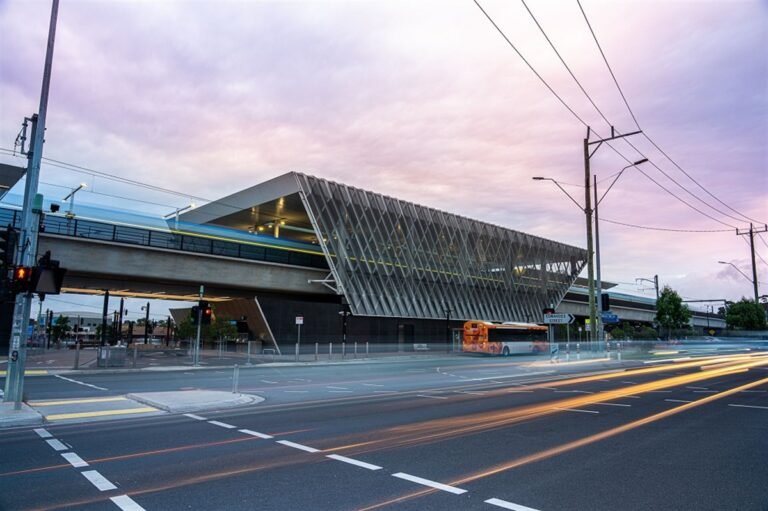 Reservoir train station modern architecture at dusk with pink sky